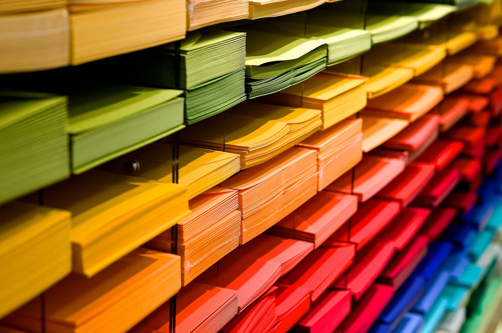 Wholesale stacks of office paper and envelopes on warehouse shelving